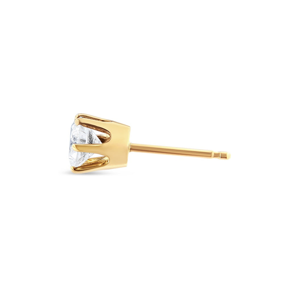 Side angle view of a yellow metal stud earring featuring a single round white gemstone in a six-prong setting.