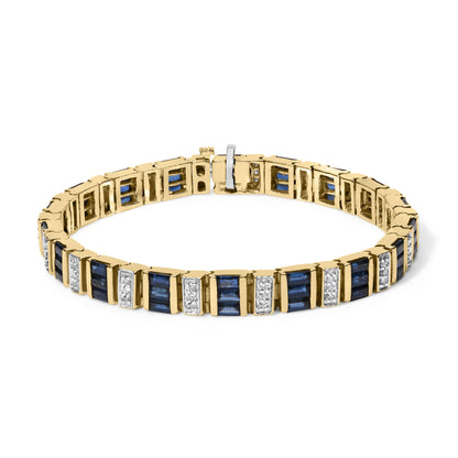 Yellow bracelet with alternating blue baguette-shaped gemstones in channel settings and sections of round white gemstones in shared prong settings, shown from a front angle.