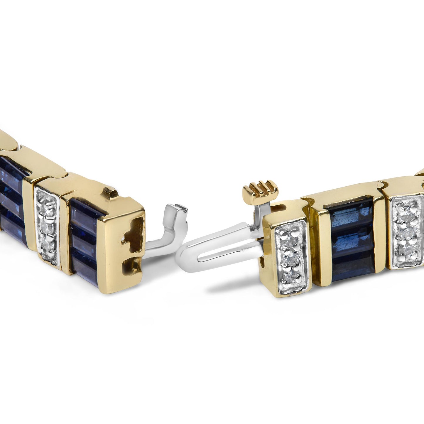 Close-up, angled shot of a yellow bracelet clasp featuring alternating rectangular blue baguette-shaped gemstones in channel settings and rectangular sections with clusters of round white gemstones in shared prong settings.