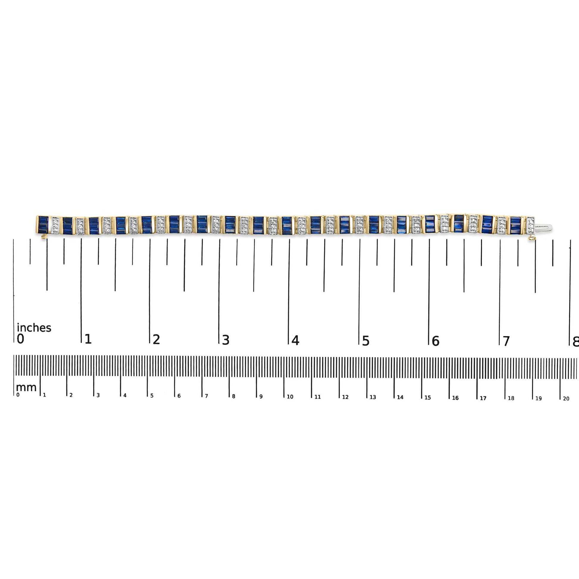 Top-down view of a yellow bracelet with alternating blue baguette-shaped gemstones and white round-shaped gemstones set in a linear pattern, placed on a ruler for size reference.