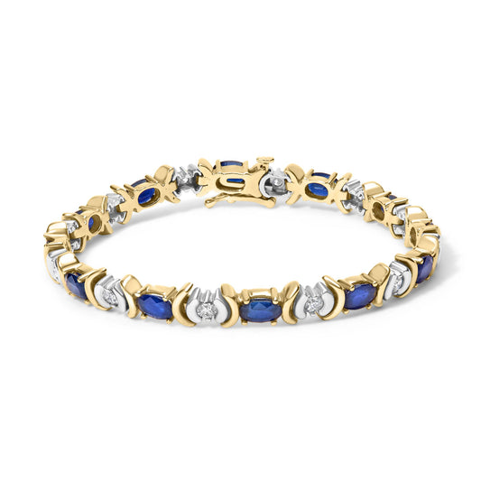 Yellow bracelet with alternating oval blue gemstones and round white gemstones in prong settings, shown in a slightly angled top view.