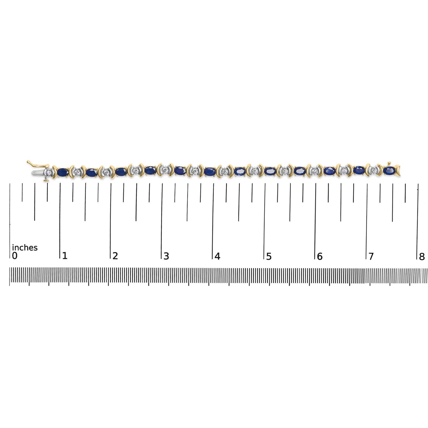 Top-down view of a yellow metal bracelet with alternating blue oval gemstones and white round gemstones, shown on a ruler for size reference.