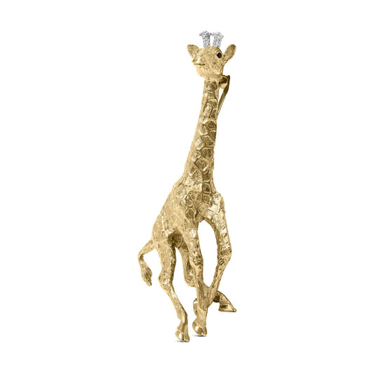 Yellow metal giraffe brooch with textured body, adorned with white and blue round gemstones on its head, shown from a front angled view.