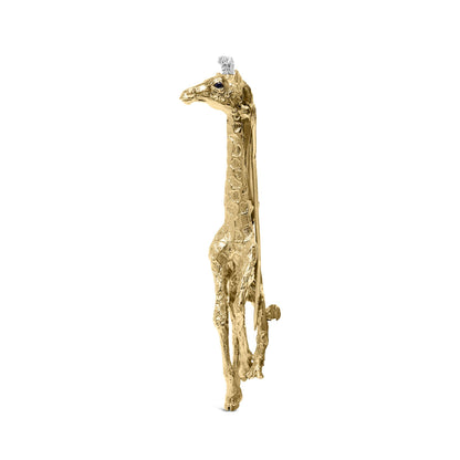 Side view of a yellow metal giraffe-shaped brooch with white and blue round gemstones in shared prong and bezel settings.