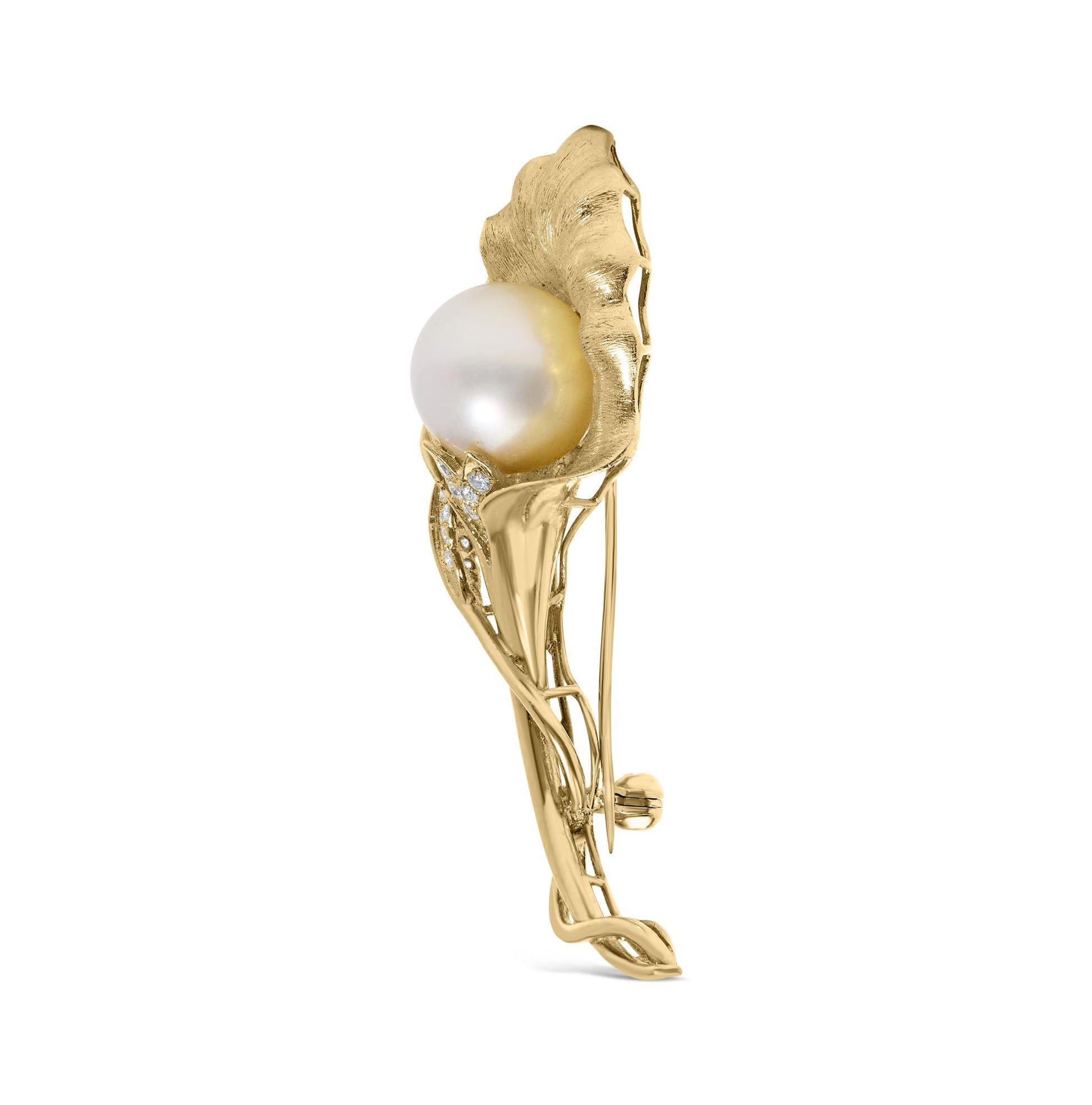 Side angle view of a yellow metal brooch featuring a large white round gemstone and several small white round gemstones in pave setting.
