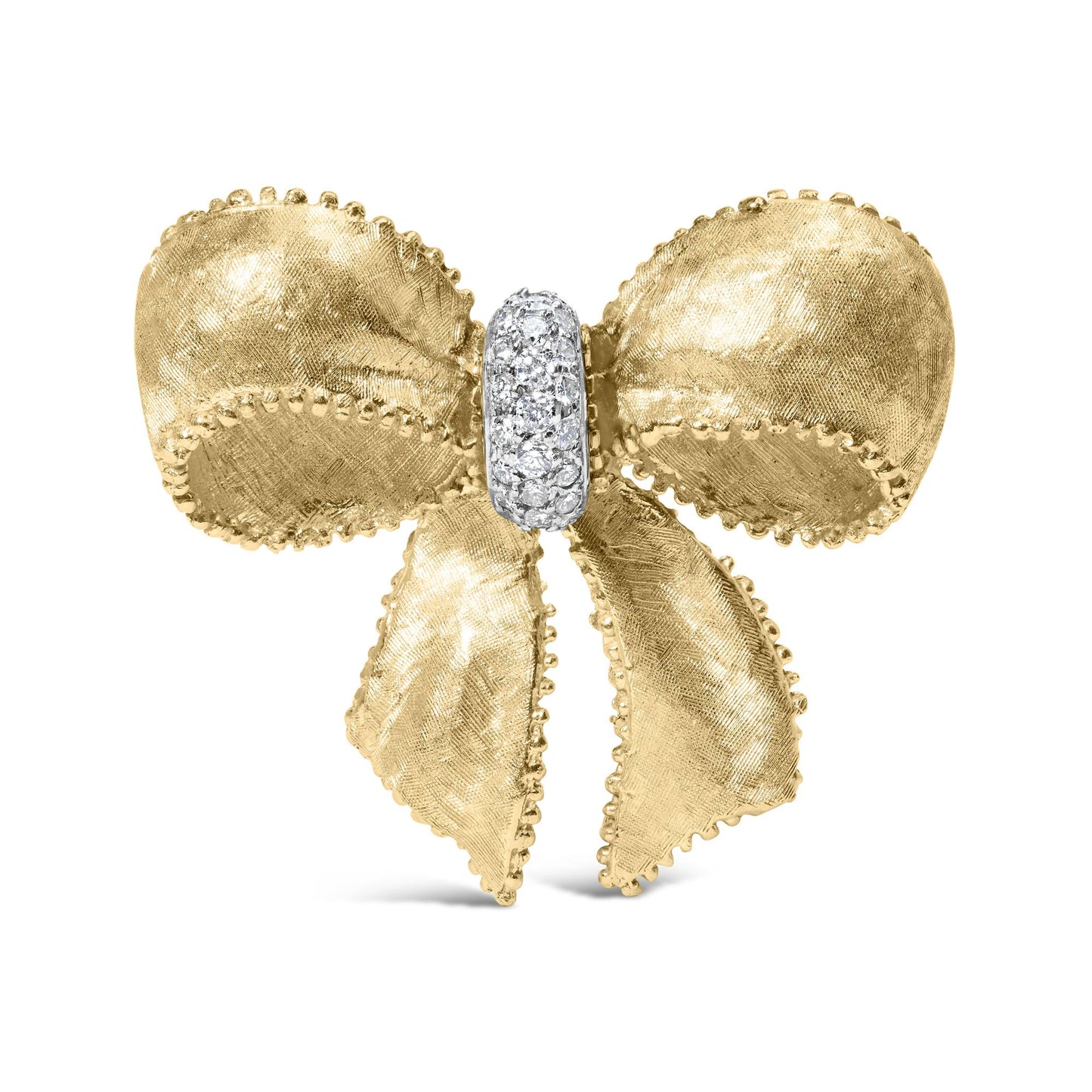 Front-facing shot of a yellow metal bow-shaped brooch with textured surfaces and scalloped edges, featuring a central ribbon loop adorned with multiple round white gemstones in a shared prong setting.