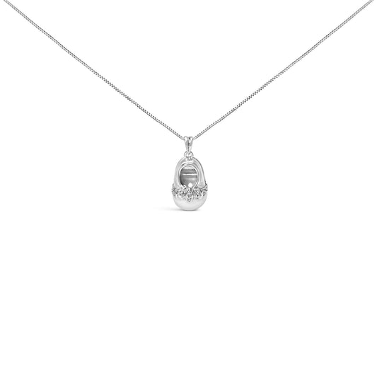 White metal necklace with an oval-shaped pendant featuring a cluster of round white gemstones in 4-prong settings, shown in a front-facing close-up shot.
