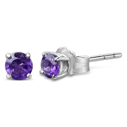 Close-up front and side view of white metal stud earrings with round purple gemstones in four-prong settings.