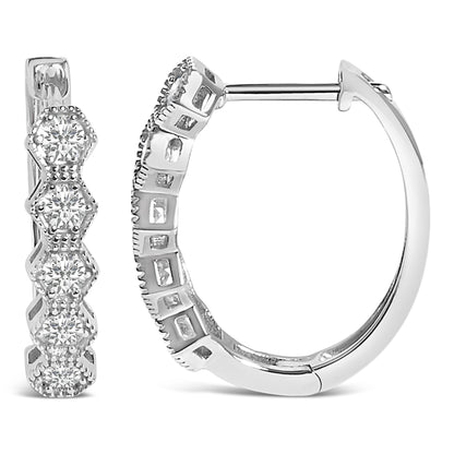 Close-up front and side views of white metal hoop earrings with round white gemstones in a 6-prong setting along the outer edge.