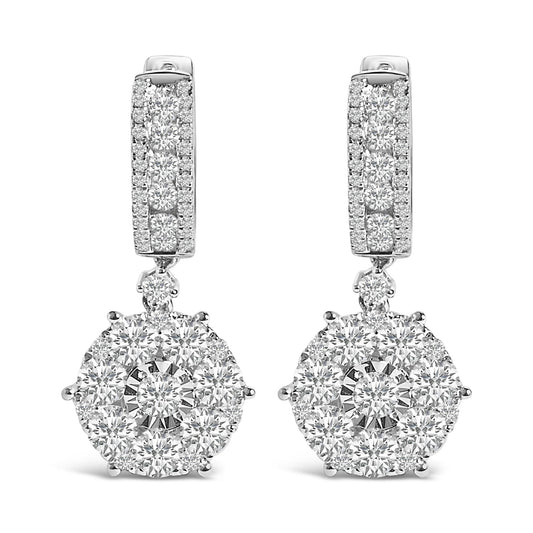 Front view of a pair of white metal drop earrings with multiple round white gemstones in various settings, featuring a rectangular upper part and a circular cluster pendant.