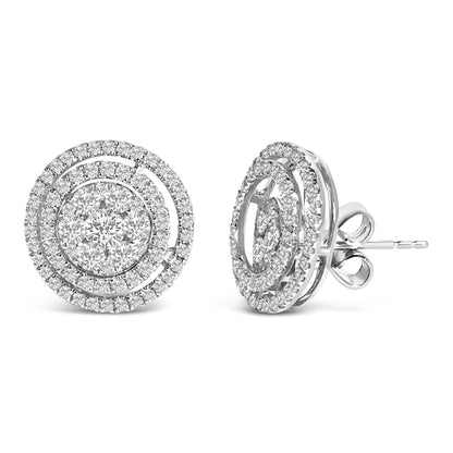 Pair of white metal circular stud earrings with concentric rows of round white gemstones, shown in a front and side angle view on a white background.
