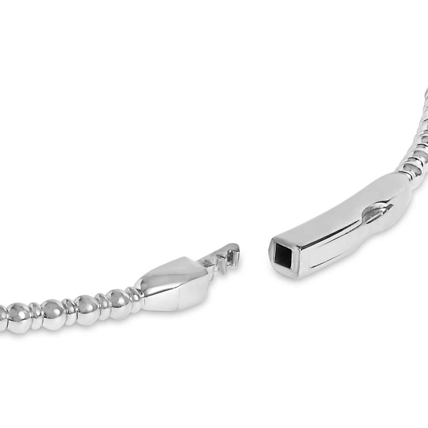 Close-up angled view of a white metal bracelet clasp with round white gemstones in shared prong settings along the band.