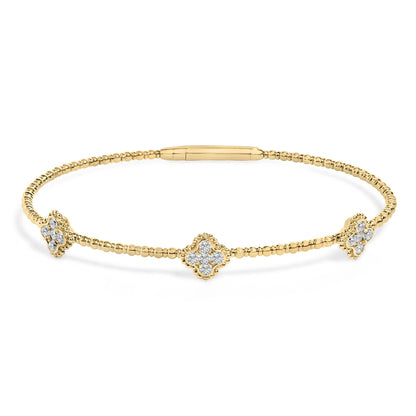 Yellow bracelet with round white gemstones in prong settings arranged in floral shapes, shown in a front-facing angle on a white background.