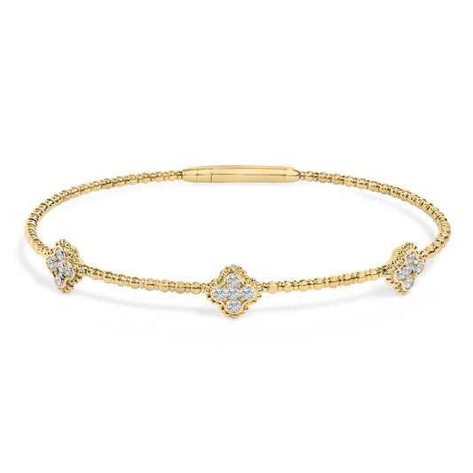 Yellow bracelet with round white gemstones in prong settings arranged in floral shapes, shown in a front-facing angle on a white background.