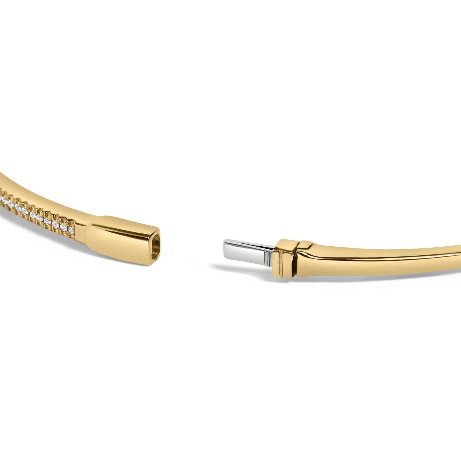 Close-up image of an open yellow bracelet with a line of small round white gemstones in prong settings along part of its length, shown at an angle on a white background.