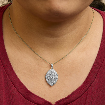 Necklace with marquise-shaped pendant featuring clustered white round and baguette gemstones in prong settings, shown worn on a model, front close-up angle.
