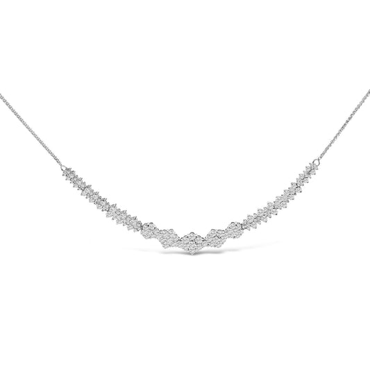 White metal necklace with a V-shaped design featuring clusters of round white gemstones in shared prong settings, shown in a front-facing close-up angle.