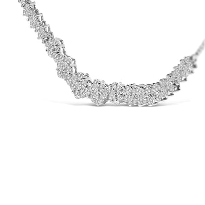 Close-up front angle of a white necklace featuring multiple round white gemstones in a shared prong setting.