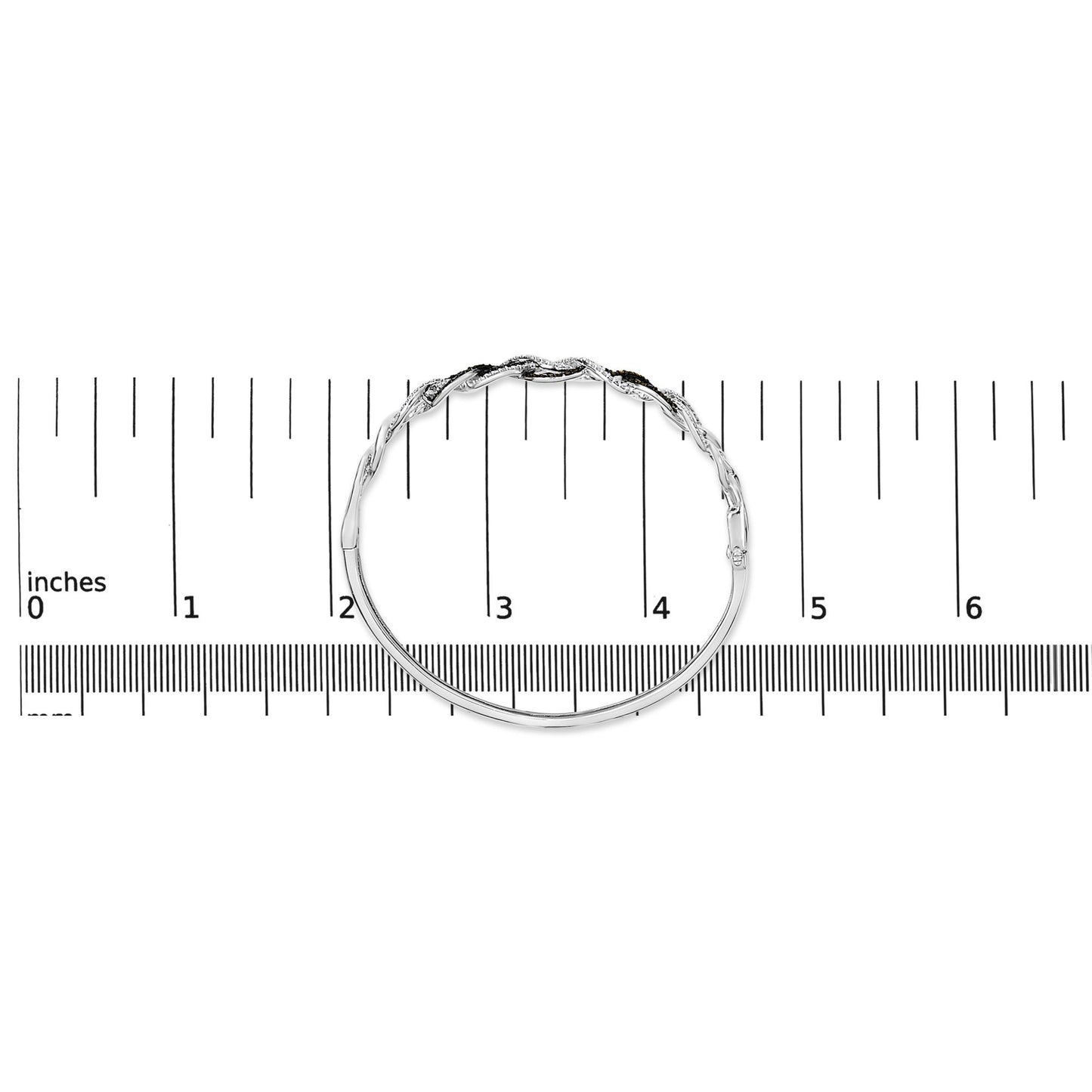 Bracelet with intertwined design featuring round black and white gemstones in shared prong settings, shown in top view on a scale.