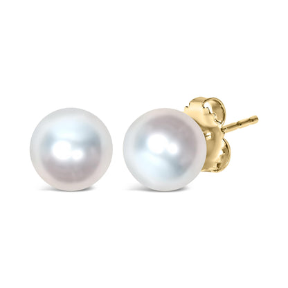 Close-up front angle of a pair of yellow metal stud earrings with round white gemstone centers.