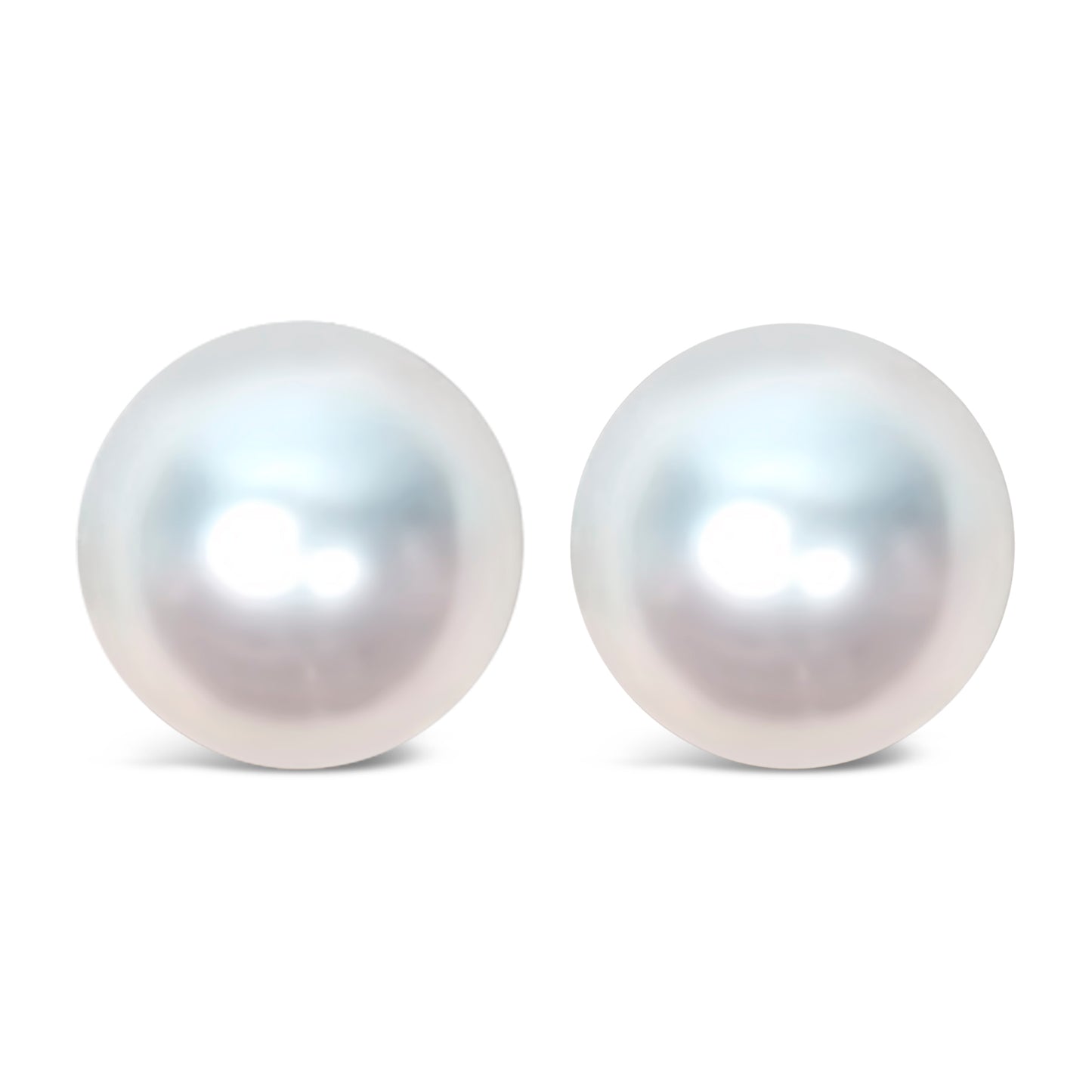 Close-up front angle of a pair of yellow metal earrings featuring large round white gemstones.