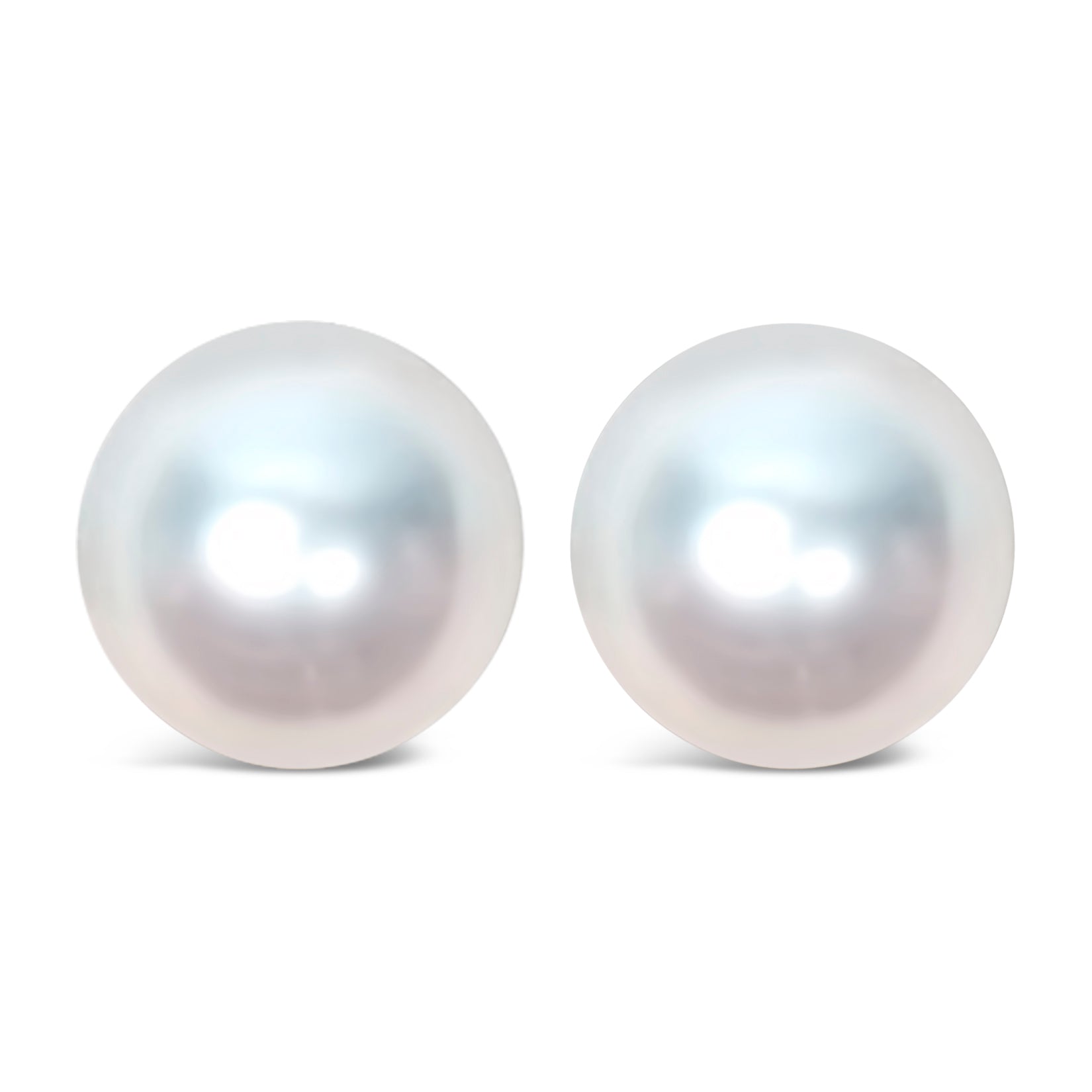 Close-up front angle of a pair of yellow metal earrings featuring large round white gemstones.