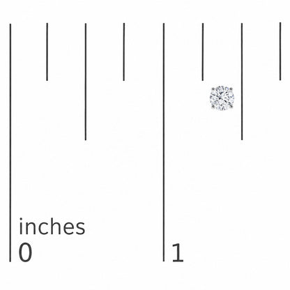 Close-up front angle image of a single white metal stud earring with a round white gemstone in a 4-prong setting, shown on a measurement scale.