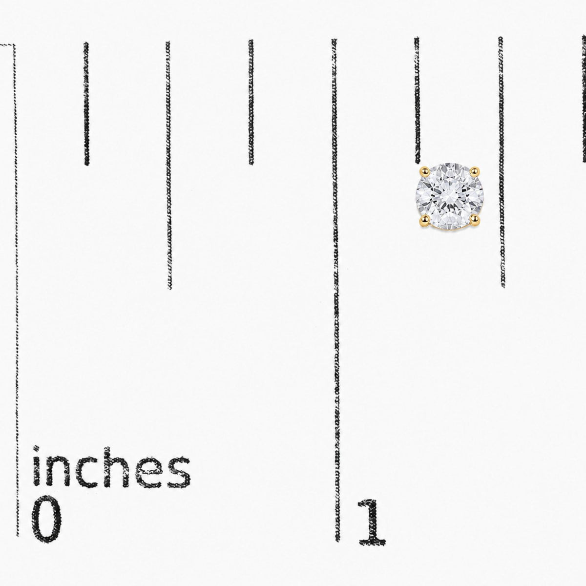 Close-up front angle of a pair of yellow metal stud earrings, each featuring a round white gemstone in a four-prong setting, shown on a scale.