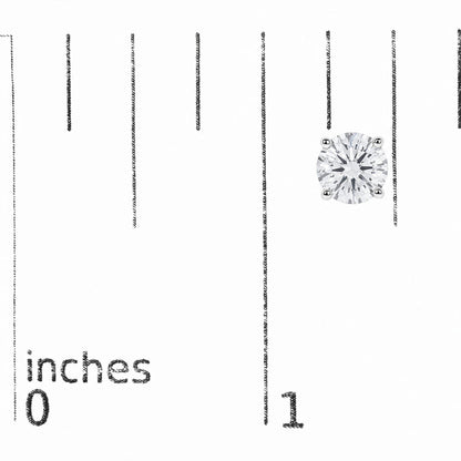 Close-up image of a single white earring with a round white gemstone in a four-prong setting, shown on a scale with measurement markings in inches, shot from above.