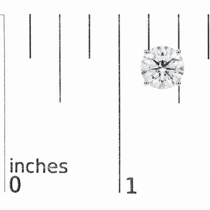 Close-up front angle of white metal stud earrings each set with a single round white gemstone in a 4-prong setting, shown on a scale.