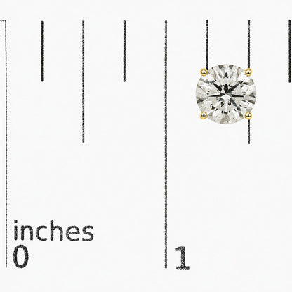 Close-up front angle of a yellow metal stud earring with a round white gemstone in a four-prong setting, shown on a scale.