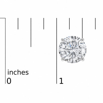 Close-up image of a single white metal stud earring featuring a round white gemstone in a four-prong setting, shown on a scale with inch markings, viewed from the front.