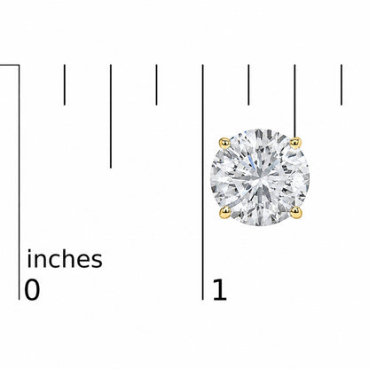Close-up front view of a yellow metal stud earring with a round white gemstone held by a four-prong setting, shown on a scale with inch measurements.