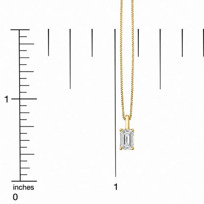 Yellow necklace with rectangular white gemstone pendant in four-prong setting, shown on a scale, close-up shot.