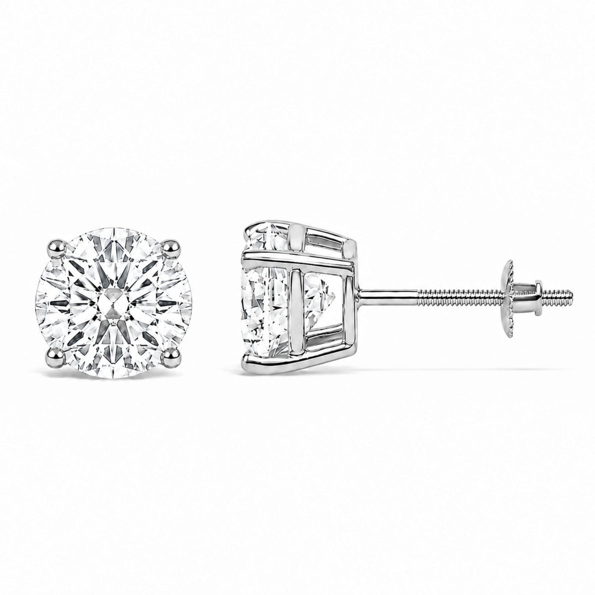 Close-up front and side view of a pair of white metal stud earrings with round white gemstones in four-prong settings, shown against a white background.