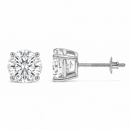 Close-up front and side view of a pair of white metal stud earrings with round white gemstones in four-prong settings, shown against a white background.