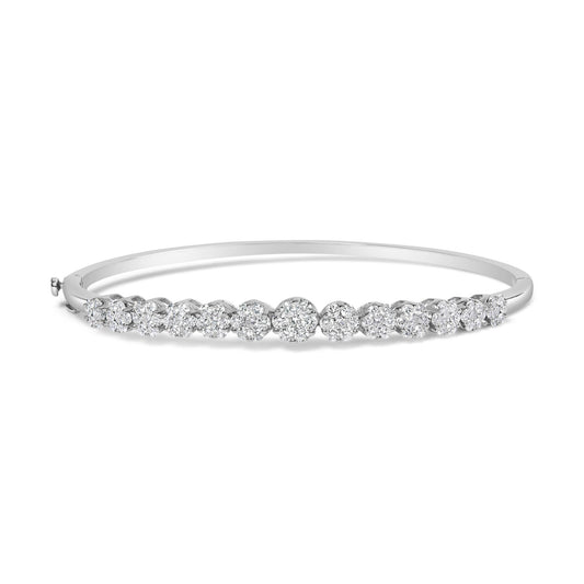 White metal bracelet with multiple clusters of round white gemstones in prong settings, shown in a front angled view.