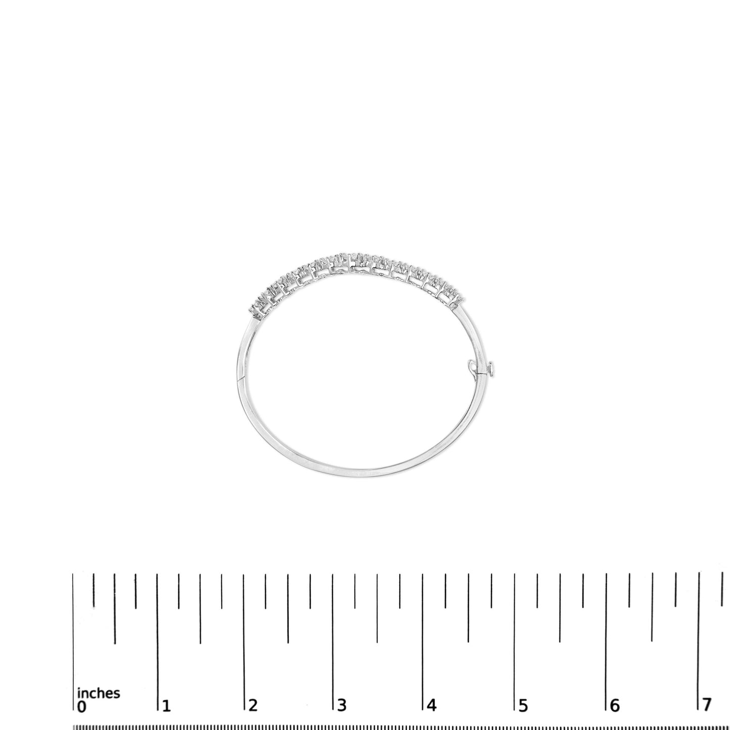 White metal bracelet with a row of prong-set round white gemstones, shown flat above a ruler for size reference, top-down view.