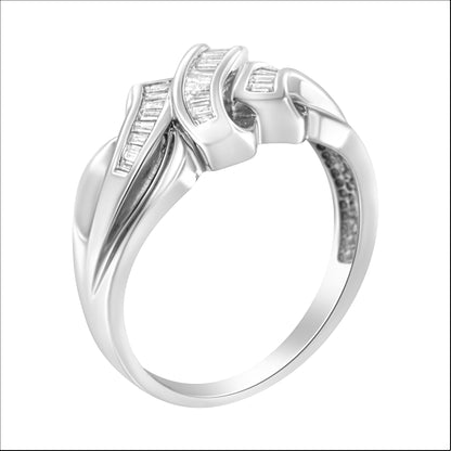 White metal ring with channel set baguette shaped white gemstones, shown at an angled close-up view.