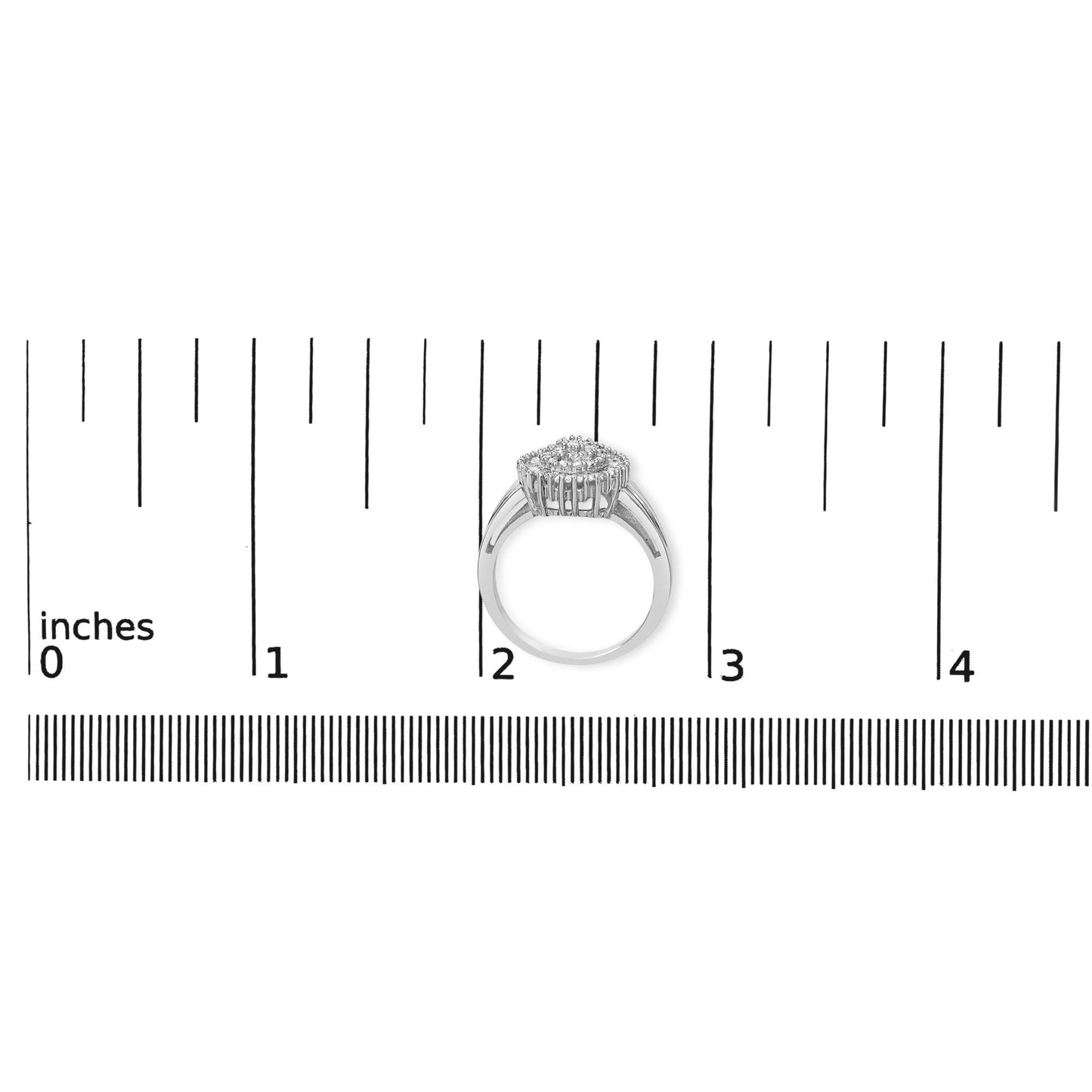 White metal ring with a square cluster of white round gemstones set in prongs and white baguette gemstones set in a channel, shown from side angle on a ruler for size reference.