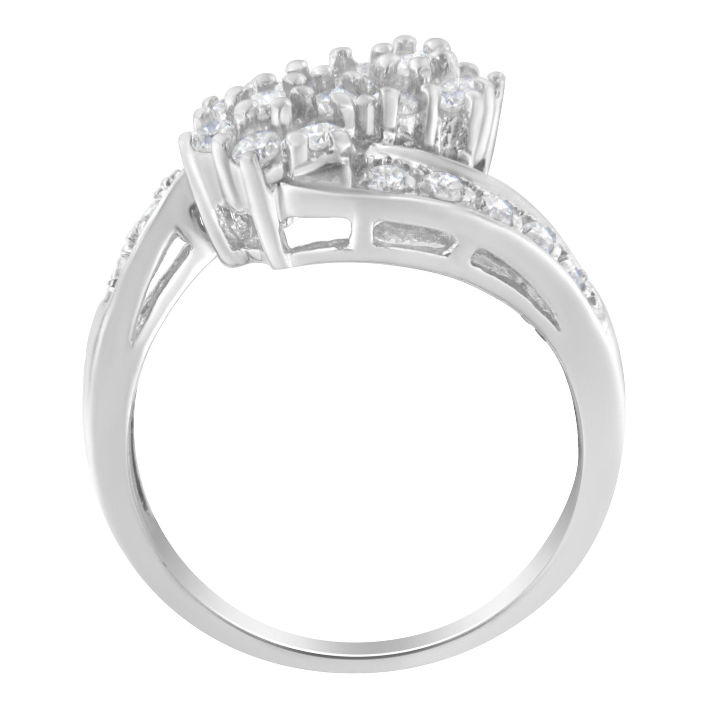 White metal ring with cluster of round white gemstones in prong setting, side angle view.