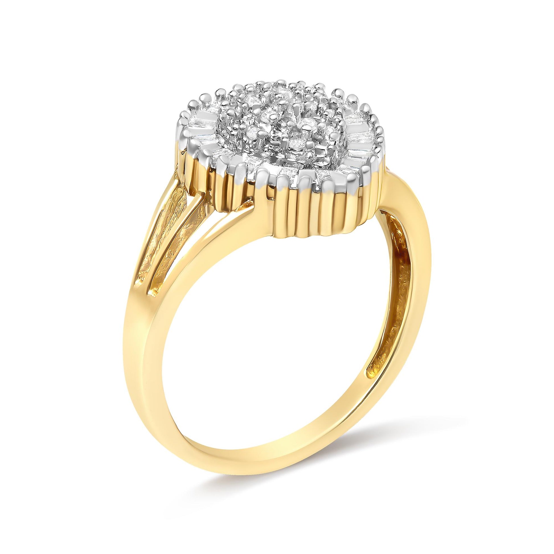 Yellow metal ring with a cluster of round white gemstones in prong settings surrounded by a border of baguette-shaped white gemstones in channel settings, shown at a slight angle.