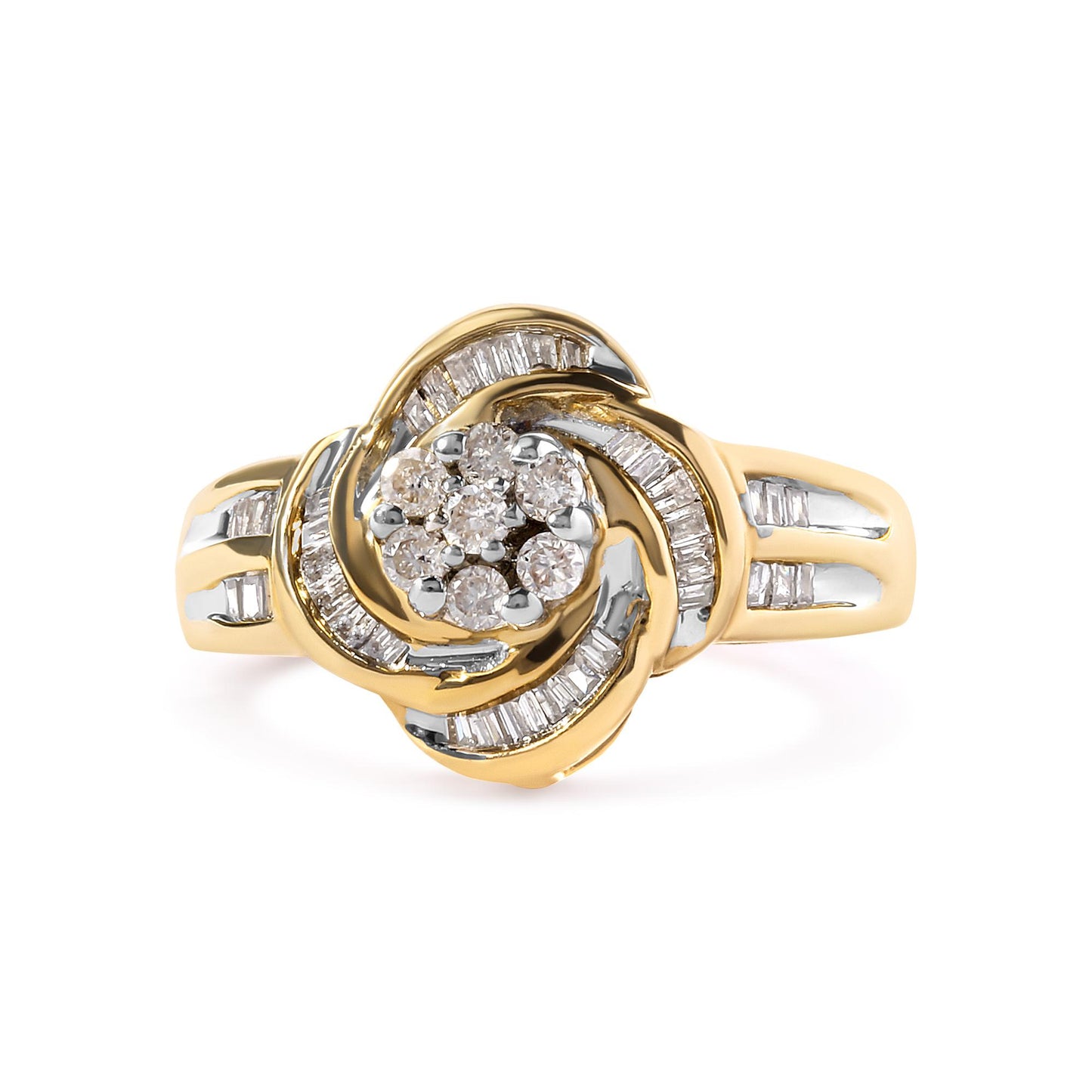 Front angle view of a yellow metal ring with a cluster of round white gemstones in prong settings at the center, surrounded by swirling bands accented with channel-set baguette white gemstones.