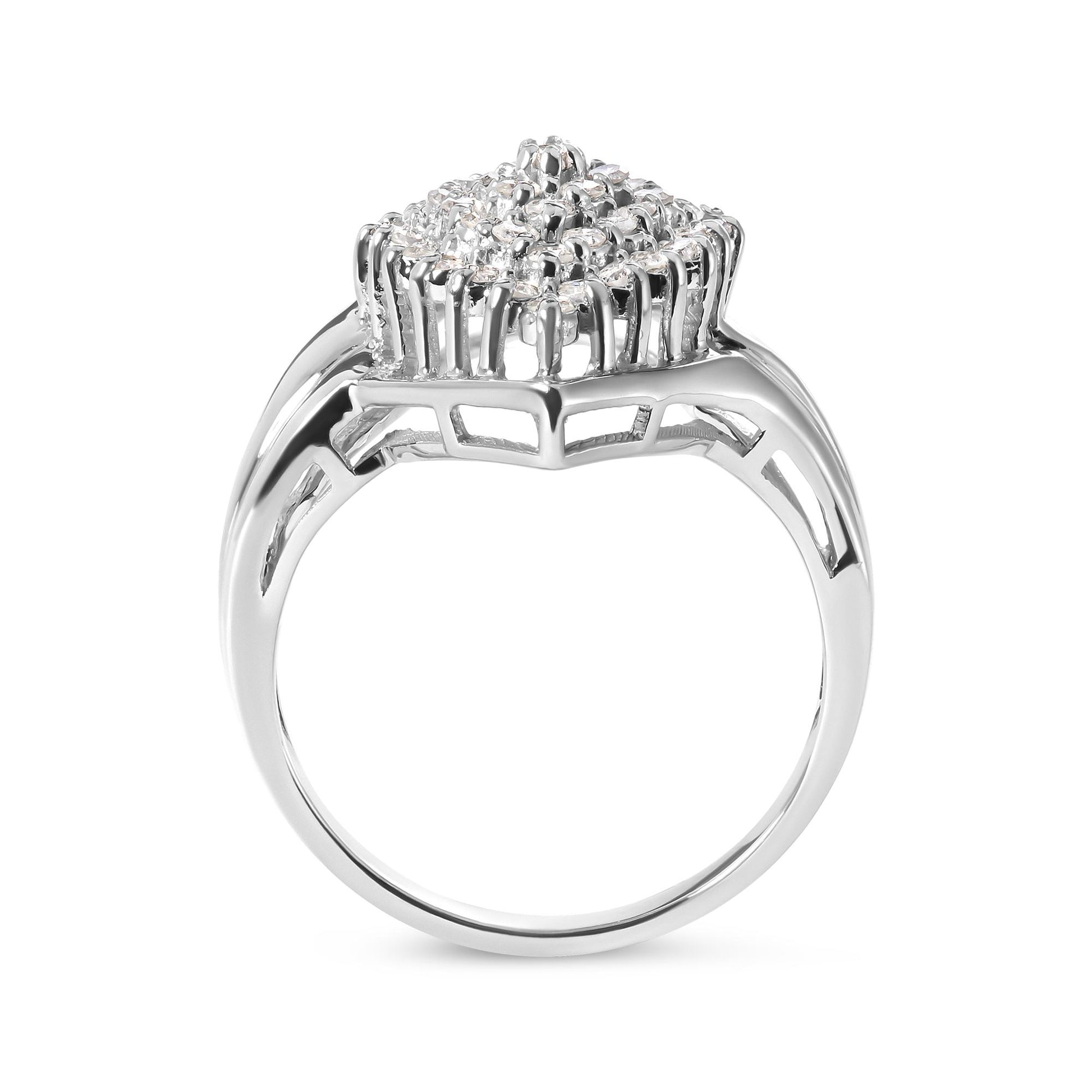 White metal ring with cluster of round white gemstones in prong settings, side profile angle.