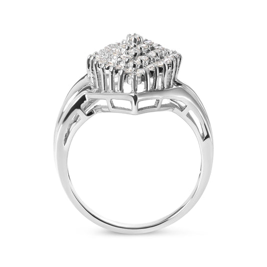 White metal ring with cluster of round white gemstones in prong settings, side profile angle.