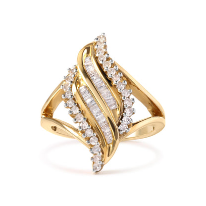 Front view of yellow metal ring with curved design featuring round prong-set white gemstones along edges and baguette channel-set white gemstones in center.