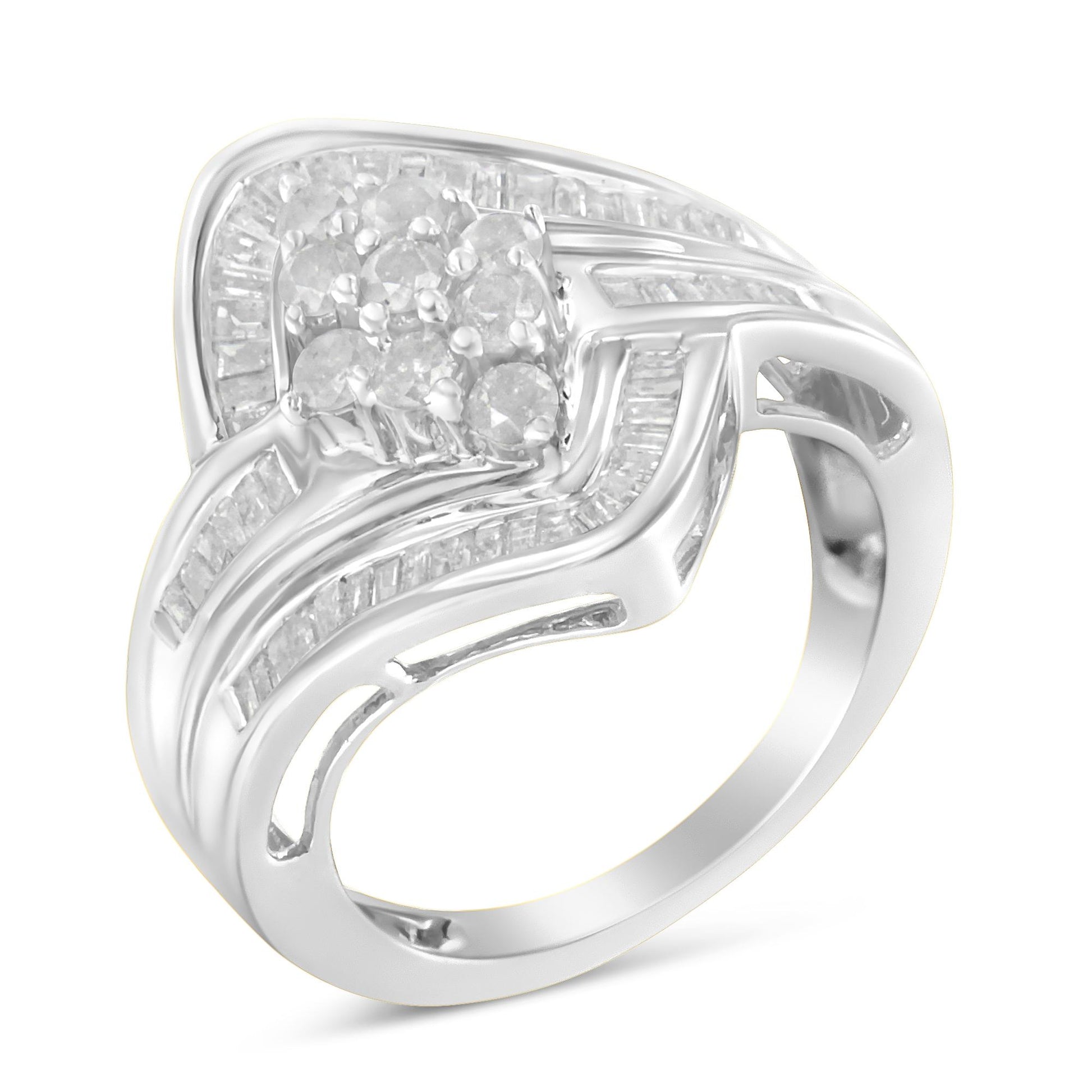 White metal ring with clusters of round white gemstones in prong settings and rows of baguette-shaped white gemstones in channel settings, shown from a front angled view.