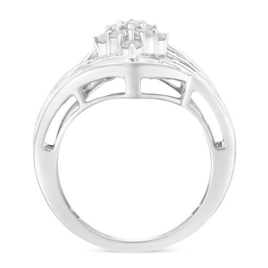 White metal ring shown from the side angle featuring round prong-set white gemstones on the top and multiple channel-set baguette white gemstones along the band.
