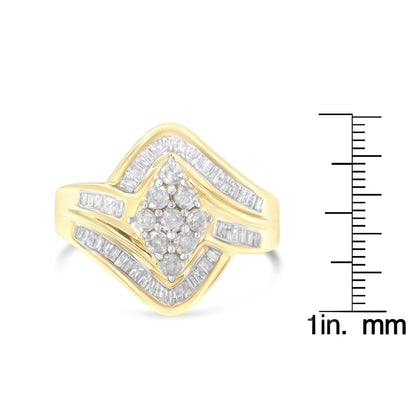Yellow ring with clusters of round white gemstones in prong settings at center, surrounded by rows of baguette white gemstones in channel settings, shown at front angle next to a ruler for size reference.