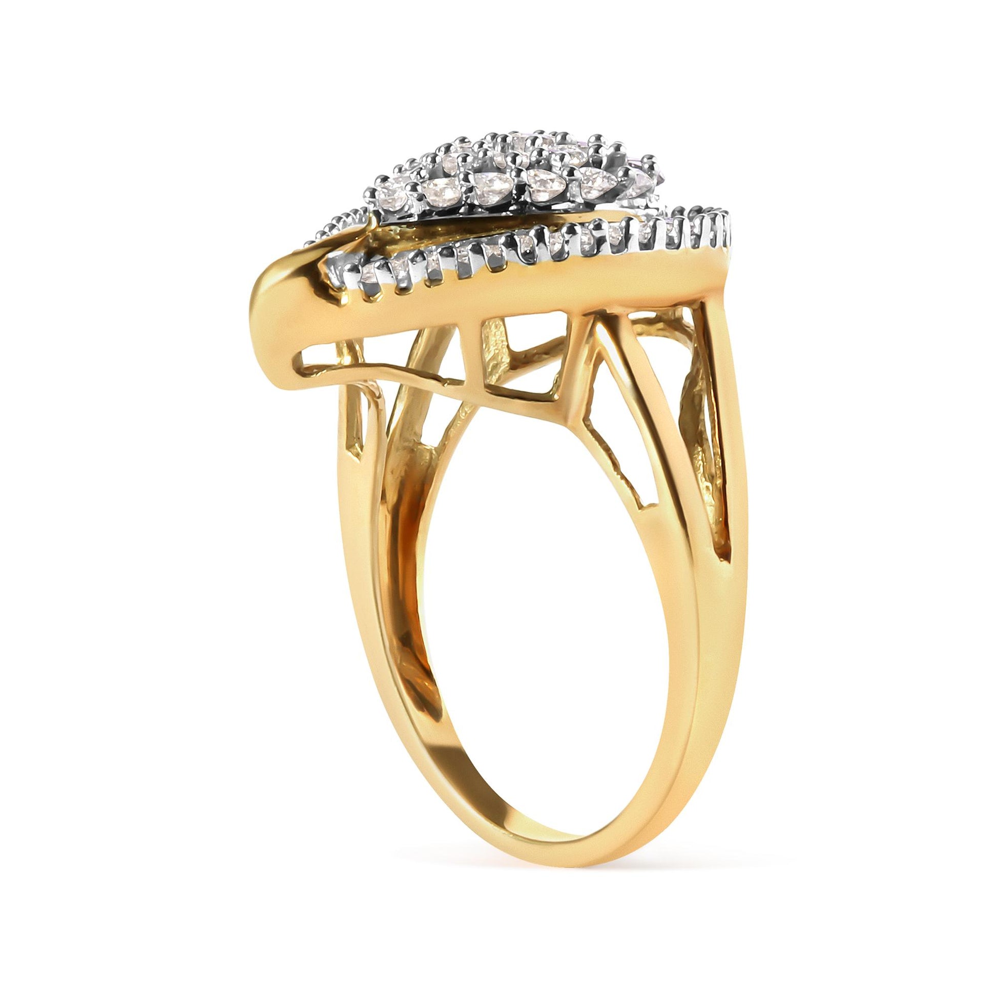 Side angle view of a yellow metal ring with round and baguette white gemstones in prong settings.
